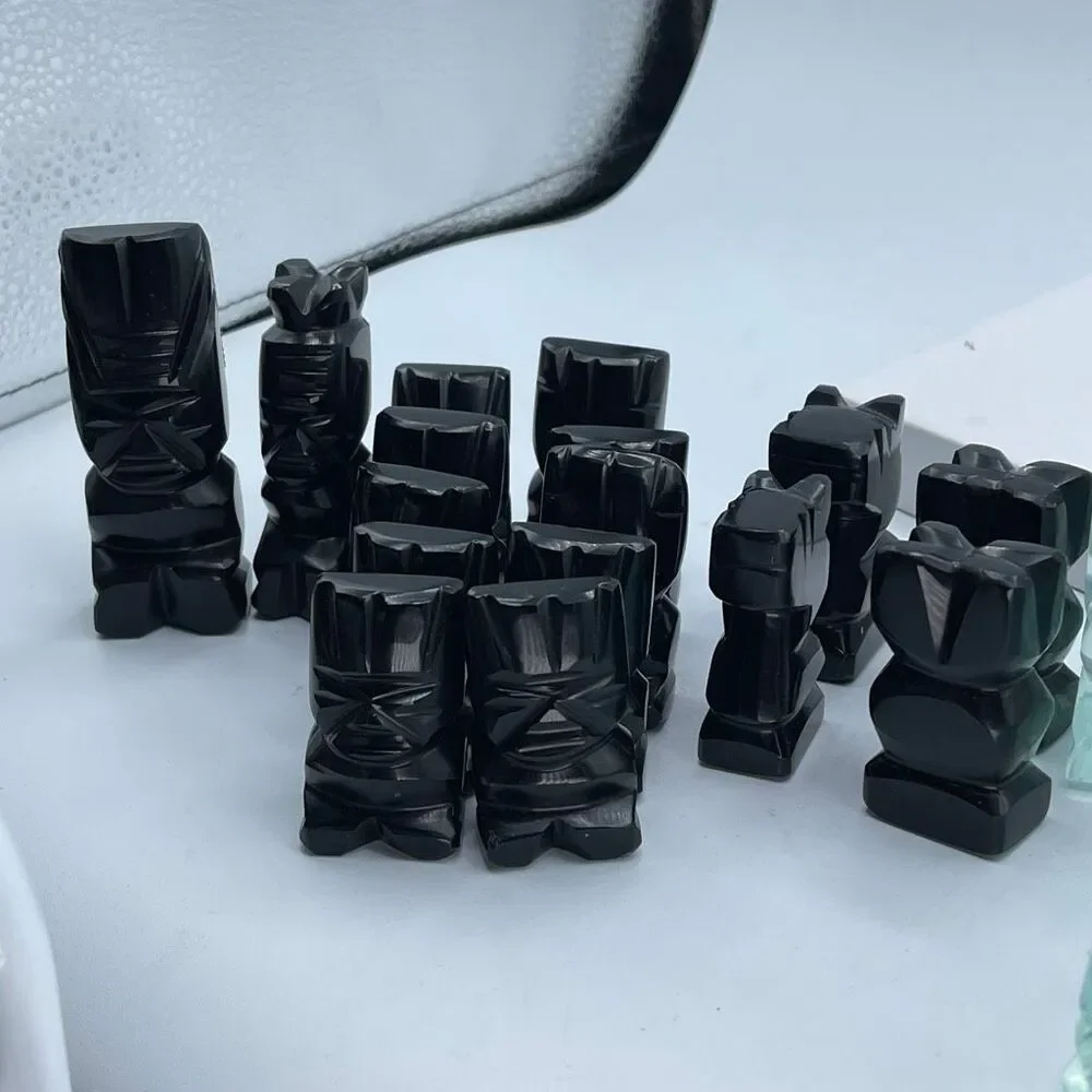 Aztec style chess pieces black obsidian green glass or onyx.